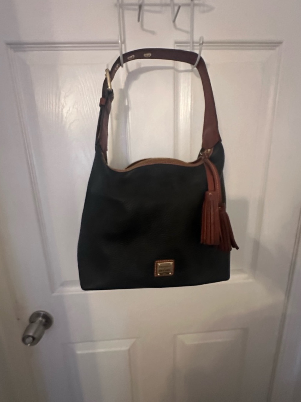 Dooney & Bourke Black Leather Shoulder Bag with Brown Trim and Tassel